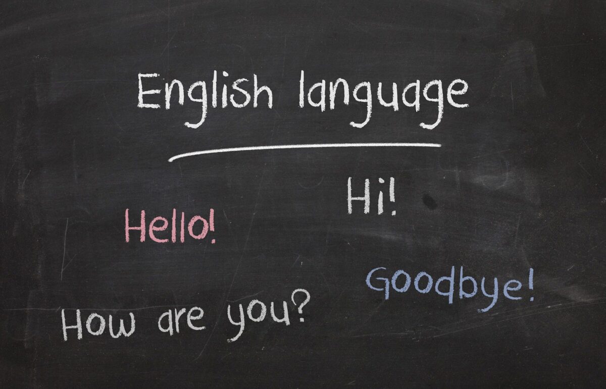 English greetings on black board